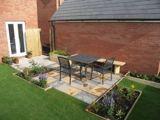 Concrete slab patio seating area, new-build back garden